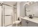 Updated bathroom with a new vanity, modern fixtures, and a glass-enclosed shower at 6800 E Tennessee Ave # 111, Denver, CO 80224