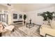 Cozy living room with stylish decor and neutral walls, complete with a soft rug and ample seating at 6800 E Tennessee Ave # 111, Denver, CO 80224