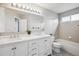 Bathroom with a dual sink vanity, new fixtures and decorative tile floor at 1551 Northridge Dr, Highlands Ranch, CO 80126