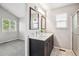 Bathroom features double vanity, unique floors, and natural lighting at 1551 Northridge Dr, Highlands Ranch, CO 80126