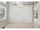 Dining room with hard wood floors, bright lighting, and light gray walls at 1551 Northridge Dr, Highlands Ranch, CO 80126