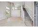Bright open floor plan with hard wood floors and staircase at 1551 Northridge Dr, Highlands Ranch, CO 80126