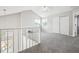 Spacious upper level loft with a vaulted ceiling, carpet, and natural light at 1551 Northridge Dr, Highlands Ranch, CO 80126