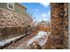 Cozy backyard featuring stone accents, patio space and a wood fence creating a private outdoor retreat at 23420 E Berry Ave, Aurora, CO 80016