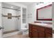 Updated bathroom features shower, vanity with granite counters and framed mirror at 23420 E Berry Ave, Aurora, CO 80016