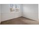 Bedroom with carpet, a window providing natural light, and crisp white baseboards at 23420 E Berry Ave, Aurora, CO 80016