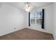 Bedroom featuring a ceiling fan and a window providing natural light at 23420 E Berry Ave, Aurora, CO 80016