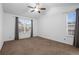 Large bedroom with high ceilings, neutral carpet, and bright windows at 23420 E Berry Ave, Aurora, CO 80016