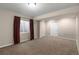 Bedroom with carpet and a window covered by red curtains at 23420 E Berry Ave, Aurora, CO 80016