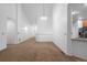 Spacious living room with vaulted ceiling, neutral paint, carpet, and ample natural light at 23420 E Berry Ave, Aurora, CO 80016