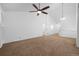 Spacious living room with vaulted ceiling, neutral paint, carpet, and ample natural light at 23420 E Berry Ave, Aurora, CO 80016