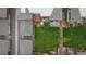 Birds eye view of fenced backyard with lawn, patio area, landscaping, and rock pathways between residential homes at 1264 S Crystal Way, Aurora, CO 80012
