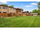 Large backyard with lush green grass and privacy fence, ideal for outdoor living at 1264 S Crystal Way, Aurora, CO 80012
