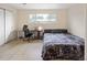 Bedroom featuring a comfortable bed, a desk, and a window offering natural light at 1264 S Crystal Way, Aurora, CO 80012