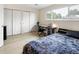 Bedroom with a comfortable bed, a desk, and a window offering natural light at 1264 S Crystal Way, Aurora, CO 80012