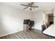 Bright dining area with contemporary gray wood flooring and ceiling fan at 1264 S Crystal Way, Aurora, CO 80012