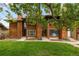 Charming townhomes with cedar siding, lush front lawns and mature shade trees at 1264 S Crystal Way, Aurora, CO 80012