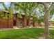 Charming townhomes with cedar siding, lush front lawns and mature shade trees at 1264 S Crystal Way, Aurora, CO 80012