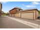 Exterior view features attached garages with neutral doors and well-maintained landscaping at 1264 S Crystal Way, Aurora, CO 80012