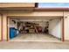 Spacious garage with ample storage, shelving, and open door at 1264 S Crystal Way, Aurora, CO 80012