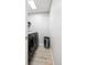 Laundry room featuring a modern washer and dryer set and a stainless steel trash can at 1264 S Crystal Way, Aurora, CO 80012