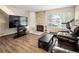 Inviting living room features a fireplace, hardwood floors, and a bright, airy atmosphere at 1264 S Crystal Way, Aurora, CO 80012