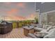 Relaxing back deck with comfortable seating and grill, perfect for outdoor entertaining at 10554 Atwood Cir, Littleton, CO 80130