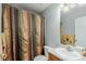 Functional bathroom with a shower, toilet, vanity, and neutral decor at 10554 Atwood Cir, Littleton, CO 80130