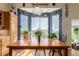 Bright kitchen eat-in area with natural light, wood floors, and views of the outdoors at 10554 Atwood Cir, Littleton, CO 80130