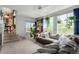 Cozy living room features a large window, comfortable seating, and charming decor, creating a welcoming atmosphere at 10554 Atwood Cir, Littleton, CO 80130