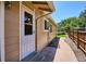 Charming backyard view featuring a door, garden and concrete walkway at 15440 E Oberlin Pl, Aurora, CO 80013