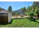 Spacious backyard includes storage shed and tiered landscaping, perfect for outdoor enjoyment at 15440 E Oberlin Pl, Aurora, CO 80013