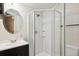 Modern bathroom with a glass-enclosed shower and updated vanity at 15440 E Oberlin Pl, Aurora, CO 80013