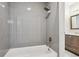 Stylish full bathroom showcasing a shower over tub with gray subway tile and modern vanity at 15440 E Oberlin Pl, Aurora, CO 80013