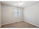 Bright bedroom featuring neutral walls, carpet, and a ceiling fan at 15440 E Oberlin Pl, Aurora, CO 80013