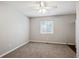 Comfortable bedroom featuring neutral carpeting, a ceiling fan, and a bright window at 15440 E Oberlin Pl, Aurora, CO 80013