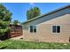 Exterior view featuring fenced yard, well-kept lawn and side of house at 15440 E Oberlin Pl, Aurora, CO 80013