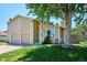 Charming two-story home with attached garage and well-manicured lawn under a clear blue sky at 15440 E Oberlin Pl, Aurora, CO 80013