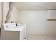 Functional laundry room with washer and dryer hookups, plus overhead cabinet at 15440 E Oberlin Pl, Aurora, CO 80013