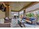 Outdoor living space with comfortable seating, grill, and string lights at 697 Sundance Cir, Erie, CO 80516