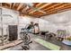 Basement gym featuring exercise equipment including a treadmill, weights, and stationary bike at 697 Sundance Cir, Erie, CO 80516