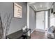 Inviting entryway with stylish decor, wood-look flooring, and a bright white front door at 697 Sundance Cir, Erie, CO 80516