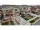 Aerial view of charming homes featuring manicured lawns and inviting curb appeal at 697 Sundance Cir, Erie, CO 80516