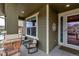 Inviting front porch with seating, providing a welcoming entrance to the home at 697 Sundance Cir, Erie, CO 80516