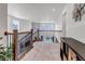 Loft area with view of living room fireplace below and view to the neighborhood at 697 Sundance Cir, Erie, CO 80516