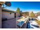 An outdoor deck with a hot tub and pergola, perfect for relaxation and entertaining in a serene backyard setting at 11 Gordon Dr, Castle Rock, CO 80104