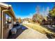A cozy backyard setting with a patio, grill, and ample space for relaxing and enjoying the outdoors at 11 Gordon Dr, Castle Rock, CO 80104