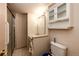 A compact bathroom features a shower, toilet, sink, and cabinet for practical use at 11 Gordon Dr, Castle Rock, CO 80104