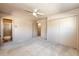 Spacious bedroom features carpet flooring, a ceiling fan, and ample closet space, creating a cozy and functional retreat at 11 Gordon Dr, Castle Rock, CO 80104