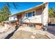 Charming exterior elevation with brick and siding, complemented by landscaping at 11 Gordon Dr, Castle Rock, CO 80104